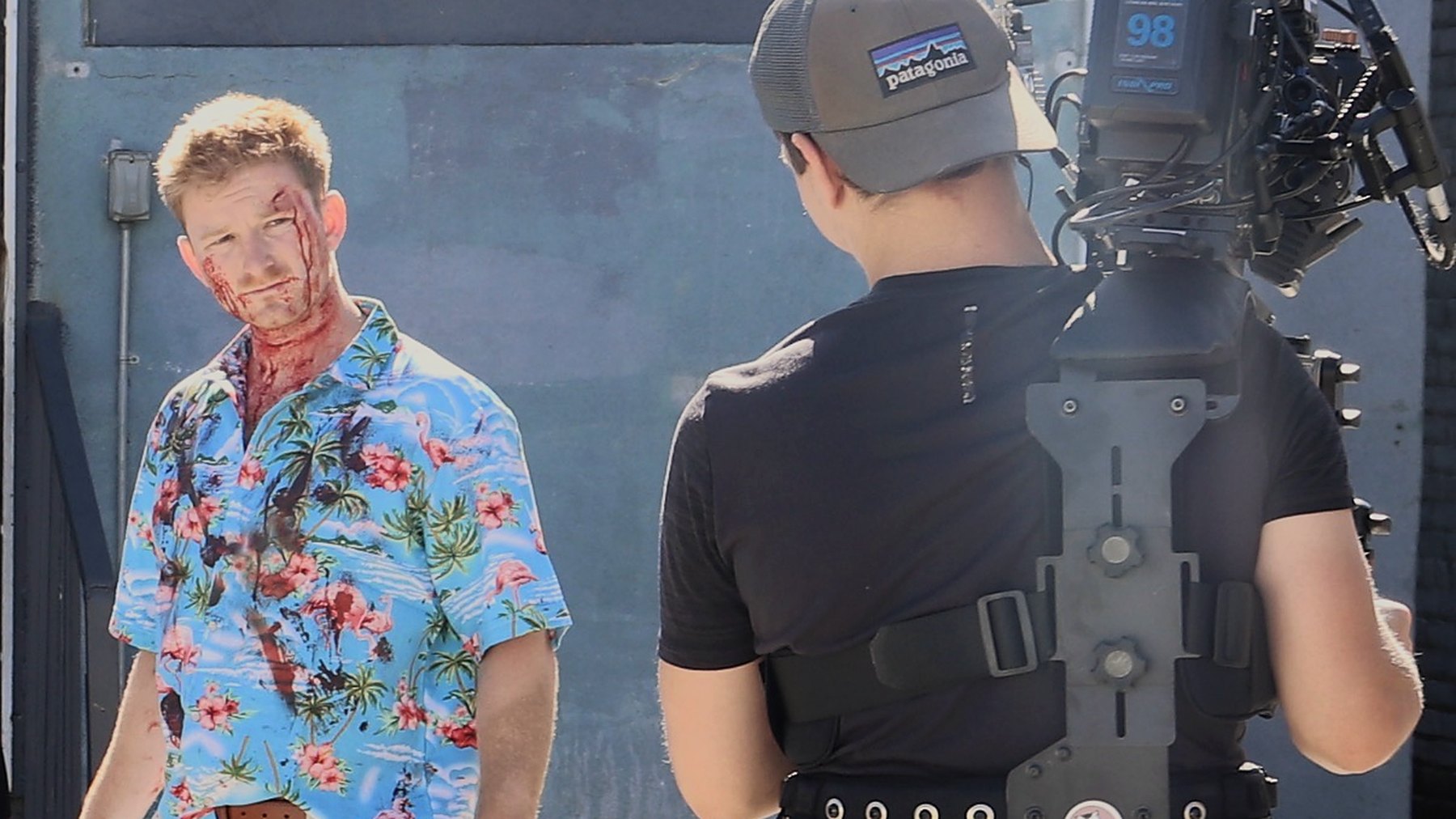 Patrick Westwater in costume on the set of Angel City Burn, facing a Steadicam operator